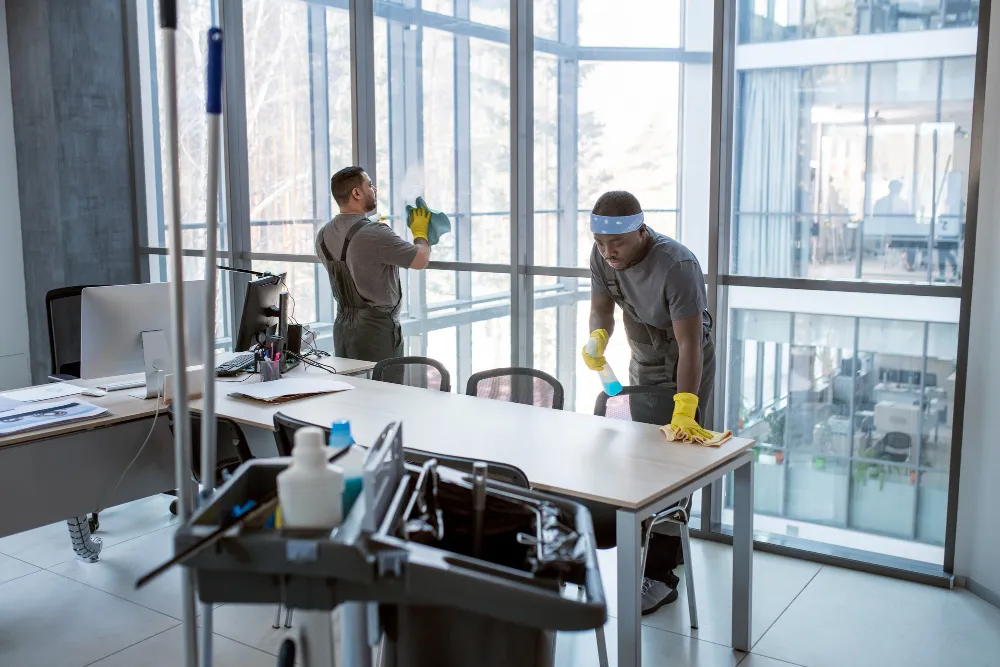 Full shot men cleaning office_converted